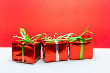 Christmas gift boxes isolated on red background, New year gift
