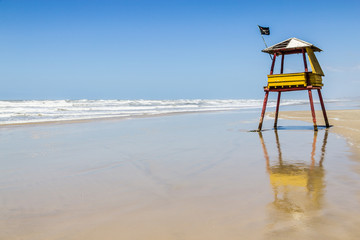 Lifeguard towe and waves and blue sky at Balnearios de Gaivota b
