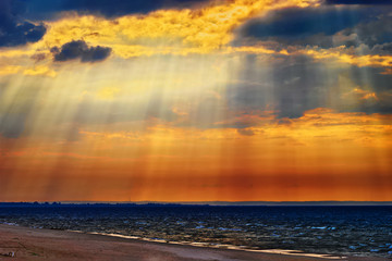 Obraz premium Cloudscape with crepuscular rays or sunbeams over the Baltic sea. Stegna, Pomerania, northern Poland.