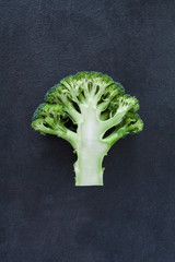 Cut green broccoli isolated on gray slate stone background