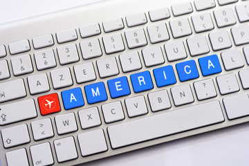 AMERICA writing on white keyboard with a aircraft sketch