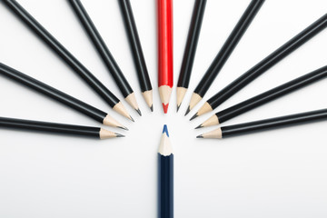 one blue pencil against all black with red leader. Abstract gay discrimination