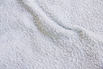 Closeup view of towel. Fluffy white background