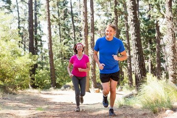 Couple smiling and running