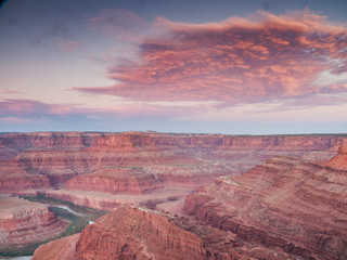 Sunset colors the sky red in Canyonlands National Park overlooking the Green River