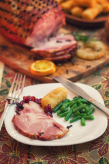 Glazed holiday ham served on a plate