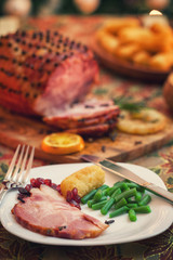 Glazed holiday ham served on a plate