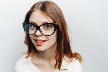 Obraz premium Portrait of a girl in glasses 