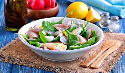 Salad of squid with boiled quail and chicken eggs, radish, green apple and baby spinach with olive oil and lemon juice.