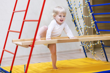 Kid playing sport on the sports complex at home