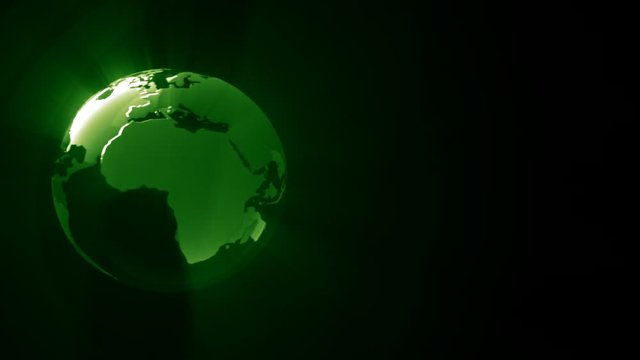 Shiny green globe orbiting and moving