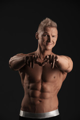 Fototapeta premium Portrait of handsome athlete grinning at camera