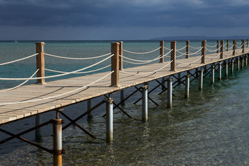 Obraz premium Long wooden pier into the sea. El Gouna. Egypt.