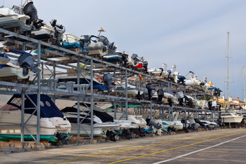 Fototapeta na wymiar Shelves with boats in the port