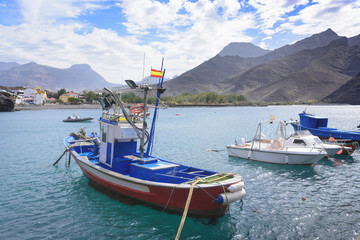 Fototapeta na wymiar Fishing boats docked at the port of la Aldea, gran canaria, spai