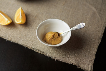 mustard in a plate, sauce in a plate