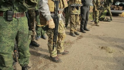 militias are fighting. Men in camouflage with guns and playing airsoft. war