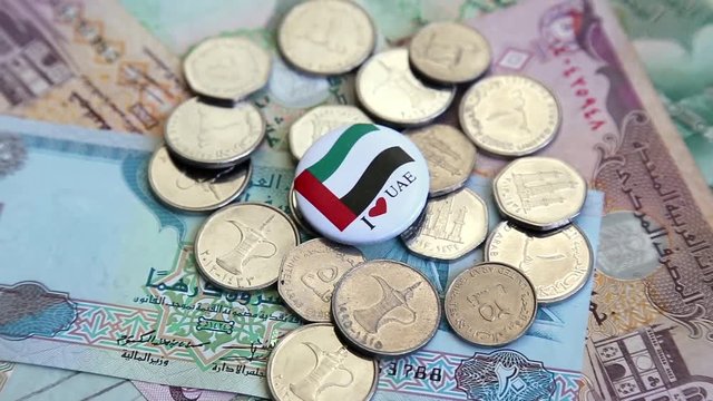 Arab money UAE dirhams on rotating surface background
