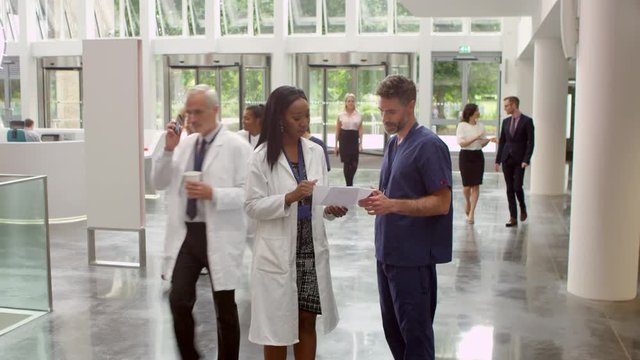 Staff In Busy Lobby Area Of Modern Hospital Shot On R3D
