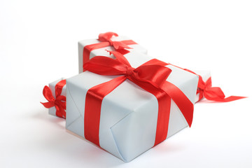 white gifts box with bow over white