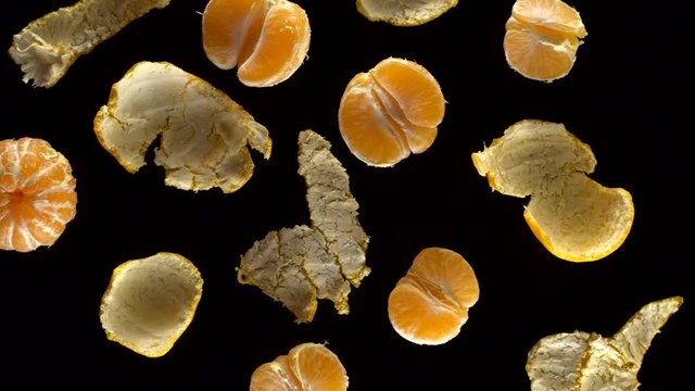 Frash tangerines on black background.
