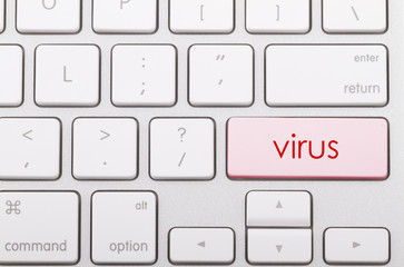Virus written on a computer keyboard.