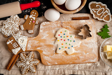 cooking christmas gingerbread on wooden background top view