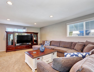 Cozy family room with brown sectional sofa