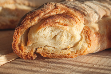 Homemade french baguette on a wooden surface