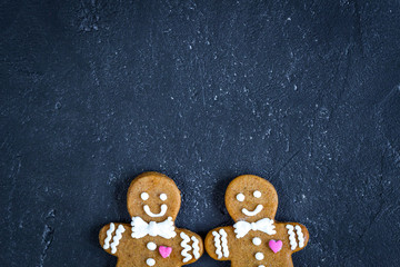 Christmas gingerbread on dark background top view