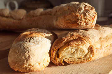 Homemade french baguette on a wooden surface