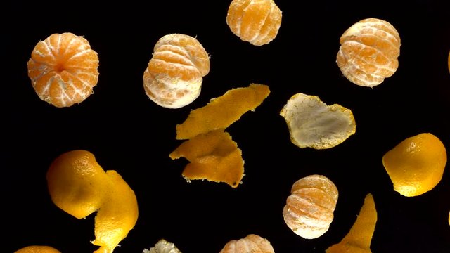 Frash tangerines on black background.