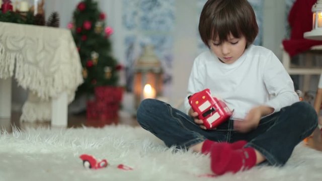 Sweet little boy, breaking his piggy bank to buy present for mom for Christmas