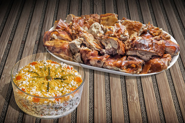 Plateful Of Spit Roasted Pork Slices With Bowl Of Garnished Olivier Salad Set On Bamboo Place Mat