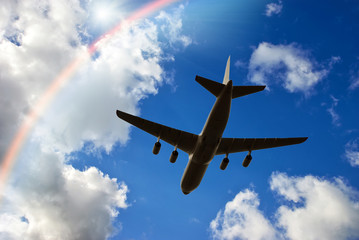 Airplane in deep blue sky. Airplane travel composition.