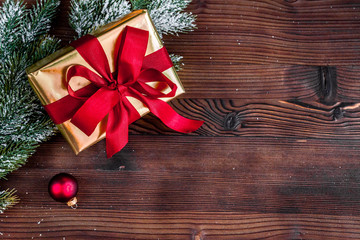 packaging christmas gifts in boxes on wooden background top view