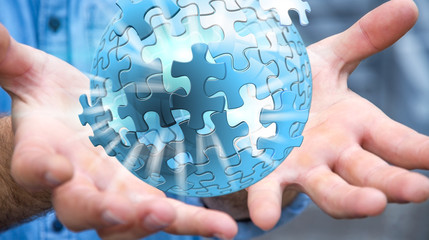 Businessman holding flying puzzle sphere ‘3D rendering’