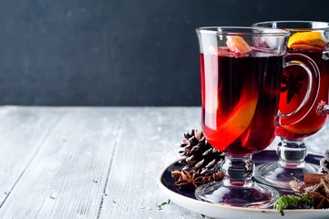wine and spices on wooden background.