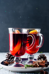 wine and spices on wooden background.