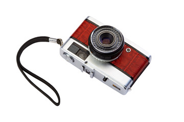 Old compact film photo camera with crocodile skin finish isolate