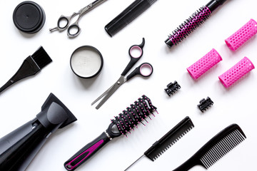 combs and hairdresser tools on white background top view