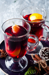 wine and spices on wooden background.