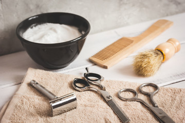 Mens hairdressing wooden desktop with tools for shaving