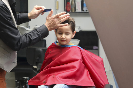 kid in a barber shop