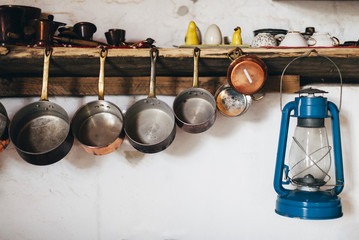 Details of dishes in a rural country kitchen. Interior design of a old style kitchen.