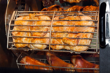 Grilled chicken in oven close up view