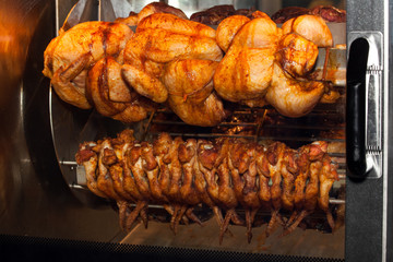 Grilled chicken in oven close up view
