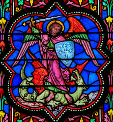 Fototapeta na wymiar Stained Glass - the Archangel Michael vanquishing Satan