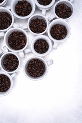 Group of coffee cup with roasted beans top view on metallic grey background