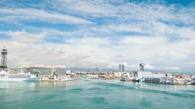 Barcelona Spain Harbor Scene with Docked Cruise Ship and Cable Car City Background
